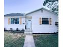 Charming single-story home featuring a new roof, fresh exterior paint, decorative shutters and landscaped yard at 811 40Th S Ave, St Petersburg, FL 33705