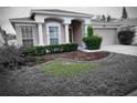 Charming single-story home featuring a well-manicured lawn and a two-car garage at 10539 Egret Haven Ln, Riverview, FL 33578