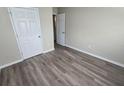 Comfortable bedroom featuring durable laminate floors and closet at 1120 Union S St, St Petersburg, FL 33712
