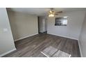 Bright living room featuring laminate flooring, fresh paint and ceiling fan at 1120 Union S St, St Petersburg, FL 33712