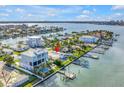 Waterfront property showcasing lush landscaping and easy access to the water at 11240 6Th E St, Treasure Island, FL 33706