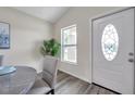 Bright entryway featuring a stylish front door with decorative glass and modern flooring at 1561 S Martin Luther King Jr Ave, Clearwater, FL 33756