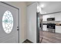 Inviting kitchen featuring stainless steel appliances and sleek white cabinetry at 1561 S Martin Luther King Jr Ave, Clearwater, FL 33756