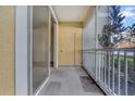 Screened balcony with sliding glass doors and storage closet at 18001 Richmond Place Dr # 116, Tampa, FL 33647
