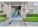 Apartment building entrance with green stairwell and unit number sign at 18001 Richmond Place Dr # 116, Tampa, FL 33647