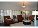 Inviting living room with comfortable seating, decorative accents, and natural light at 3212 Stevenson St, Plant City, FL 33566