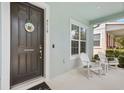 Cozy front porch with rocking chairs, offering a relaxing outdoor space at 6519 Watson Rd, Riverview, FL 33578