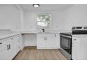 Modern kitchen with stainless steel appliances and sleek countertops at 708 E Annie St, Tampa, FL 33612