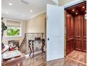 Interior view of an elevator with wood panels and gold trim at 8 Sunset Bay Dr, Belleair, FL 33756