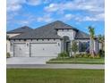Beautiful one story home with a two-car garage, well manicured lawn, and a nice landscape at 11324 Striped Bass Ct, New Port Richey, FL 34654