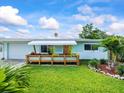 Lovely single-story home with welcoming curb appeal, charming front porch with planter boxes at 13316 Carol Dr, Hudson, FL 34667