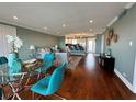 Spacious living room with hardwood floors, recessed lighting, and an open view to the kitchen and bar seating at 1365 Snell Isle Ne Blvd # 6E, St Petersburg, FL 33704