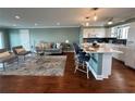 Inviting living room boasts hardwood floors, recessed lights, and is open to the updated kitchen and bar seating at 1365 Snell Isle Ne Blvd # 6E, St Petersburg, FL 33704