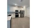 Modern kitchen featuring stainless steel appliances, and white cabinetry with stone countertops at 18848 Indian Rock Pl, Lakewood Ranch, FL 34211