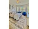 Inviting bedroom featuring natural light, a ceiling fan, and comfortable decor at 27312 Edenfield Dr, Wesley Chapel, FL 33544