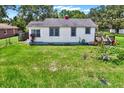 A single-story home with a well-kept lawn and beautiful landscaping at 812 W Orient St, Tampa, FL 33603