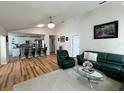 Open floor plan showcases the living room connected to the kitchen with barstool seating at 8616 Pinafore Dr, New Port Richey, FL 34653