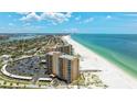 Beautiful aerial view of the condo building overlooking the gulf and white sandy beach at 880 Mandalay Ave # C512, Clearwater Beach, FL 33767