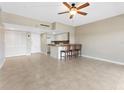 Open-concept living space featuring tile flooring, a breakfast bar, and a cozy atmosphere at 880 Mandalay Ave # C512, Clearwater Beach, FL 33767