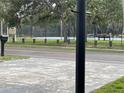 Community tennis courts provide a recreational amenity for active residents with shaded benches for spectators at 12417 N Rome Ave, Tampa, FL 33612