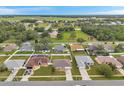An aerial view of the neighborhood showcasing homes with well-maintained yards and community layout at 15442 Arvin Dr, Brooksville, FL 34604