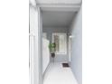 Covered entryway featuring neutral paint, white railing, and a welcoming ambiance at 18136 Nassau Point Dr, Tampa, FL 33647