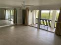 Spacious living room with tile flooring and large sliding doors leading to the balcony at 320 N Bayshore Blvd # 203, Clearwater, FL 33759