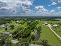 Beautiful property boasting a tranquil pond and expansive greenery, perfect for peaceful living at 4205 Old Mulberry Rd, Plant City, FL 33567