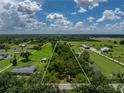 Expansive parcel with verdant fields and tree cover, ideal for development or recreation at 4205 Old Mulberry Rd, Plant City, FL 33567