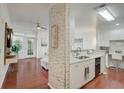 Open-concept kitchen featuring modern cabinets, stainless appliances, and breakfast bar at 4221 W Spruce St # 2328, Tampa, FL 33607