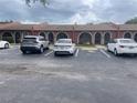 Exterior view of townhomes, showcasing parking and well-maintained landscaping at 6446 71St N St, Pinellas Park, FL 33781