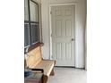 Cozy porch with a classic wooden bench and pleasant natural light at 6446 71St N St, Pinellas Park, FL 33781