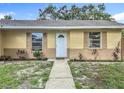 Inviting home with neat landscaping and a clean walkway leading to a welcoming front door at 6511 3Rd Ne Ave, Bradenton, FL 34208