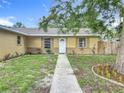 Inviting single-story home with a tidy walkway, fresh landscaping, and a neatly maintained front yard at 6511 3Rd Ne Ave, Bradenton, FL 34208
