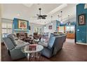 Cozy living room featuring a fireplace, comfortable seating, and a dining area, great for entertaining at 101 Carlyle Dr, Palm Harbor, FL 34683