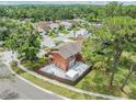 Beautiful residential area featuring a two-story home with a fenced backyard and lush green surroundings at 10520 Winrock Pl, Tampa, FL 33624