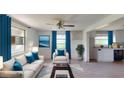 Bright and airy living room showcasing a modern design with lots of natural light and comfortable seating at 12113 Victory Dr, Hudson, FL 34667