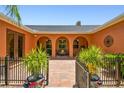 Enclosed courtyard features an outdoor seating area and charming architectural details, ideal for relaxation at 2513 Martucci Rd, Seffner, FL 33584