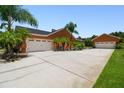 Spacious garages offer ample parking and storage; the driveway has a unique paved design at 2513 Martucci Rd, Seffner, FL 33584