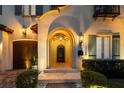 An arched entrance illuminated with sconces and recessed lighting welcomes you home at 4525 W Swann Ave, Tampa, FL 33609
