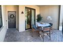 Charming patio with stone pavers, a dining table, and stylish decorations providing an inviting outdoor space at 5720 Palmer Cir # 102, Bradenton, FL 34211
