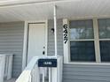 Close up of the front door of the home displaying the house number and mailbox at 6427 2Nd S Ave, St Petersburg, FL 33707
