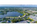 A high angle aerial view of the townhome with a lakeside view near the city at 8251 118Th Ave # 8251, Largo, FL 33773