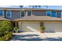 The townhome has an attached two-car garage and a well maintained yard at 8251 118Th Ave # 8251, Largo, FL 33773