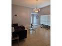 Cozy living room with comfortable seating and ample natural light at 8718 Lindenhurst Pl, Tampa, FL 33634