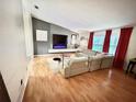 Stylish living room featuring hardwood floors, a modern fireplace, and bright, natural light at 945 College Hill Dr, Clearwater, FL 33765