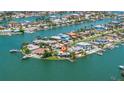 Stunning aerial view showcasing the waterfront property's ideal location and neighborhood at 11055 7Th E St, Treasure Island, FL 33706