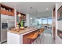 Contemporary kitchen features granite countertops, stainless steel appliances, and open layout to living area with a beautiful view at 111 N 12Th St # 1707, Tampa, FL 33602
