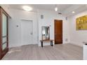 Bright living space with sleek flooring, white walls, modern fixtures, and access to other rooms at 111 N 12Th St # 1707, Tampa, FL 33602