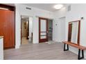 Bright living space with sleek flooring, modern fixtures, and access to the bathroom and walk-in closet at 111 N 12Th St # 1707, Tampa, FL 33602